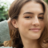 Gold Heart Hoops, shown on model