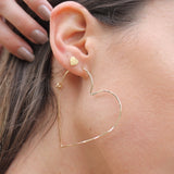 Single Gold Heart Hoop Earring, shown on model