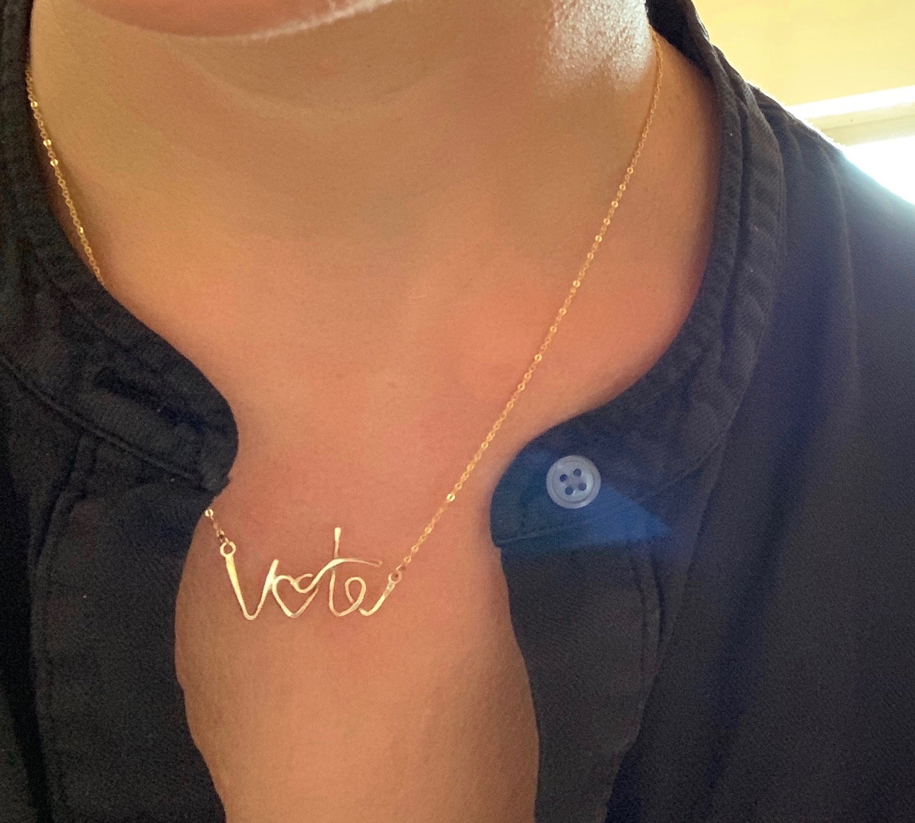 Vote Necklace, shown on model