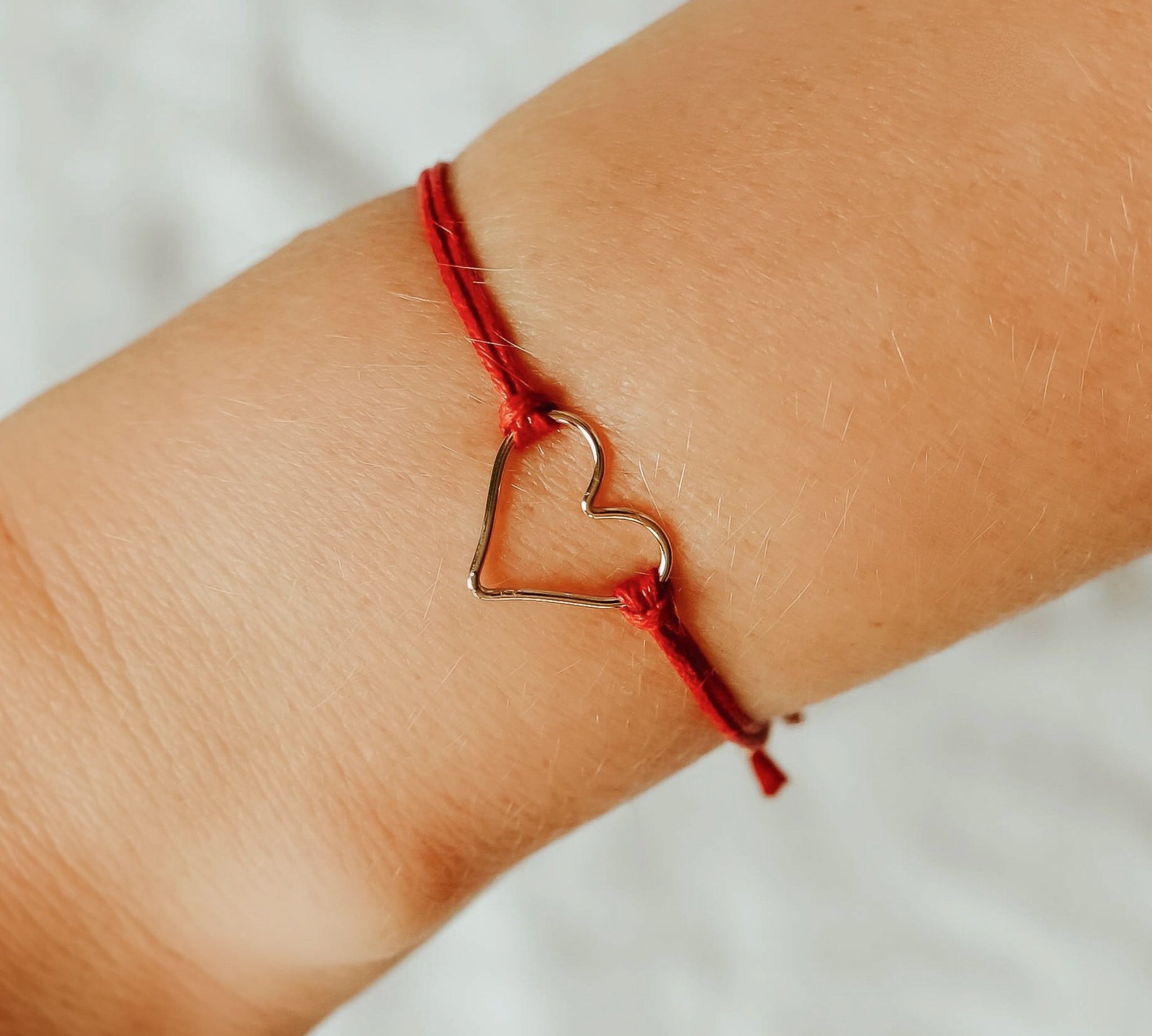 Red 'Armed with Love' Bracelet, shown on model