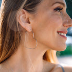 Silver Heart Hoops, shown on model