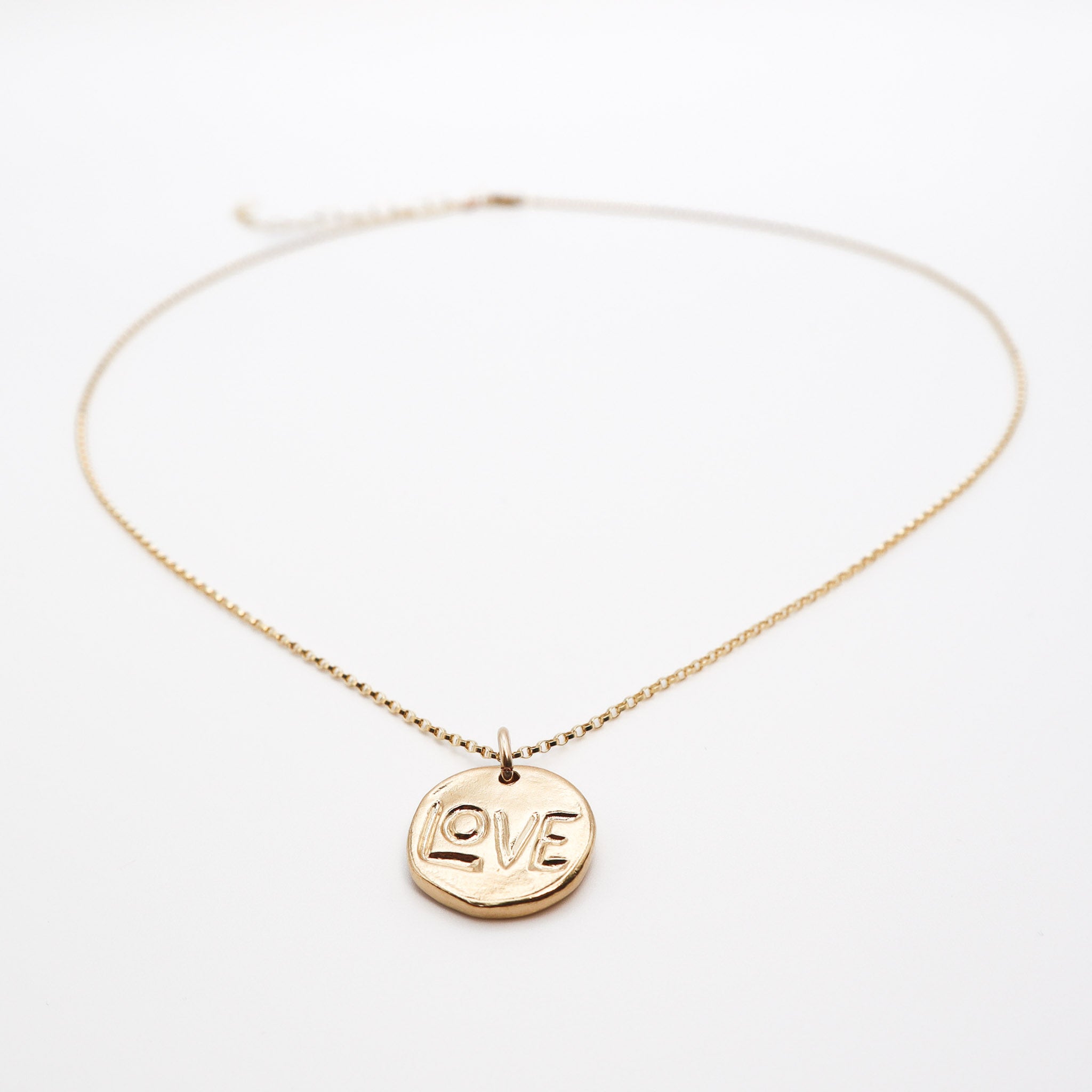 Gold Love Pendant Necklace, product image with charm closeup