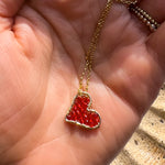 Scarlet Mini Love Drop Necklace, modeled in palm of hand