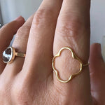 Gold Clover Ring, shown closeup on model