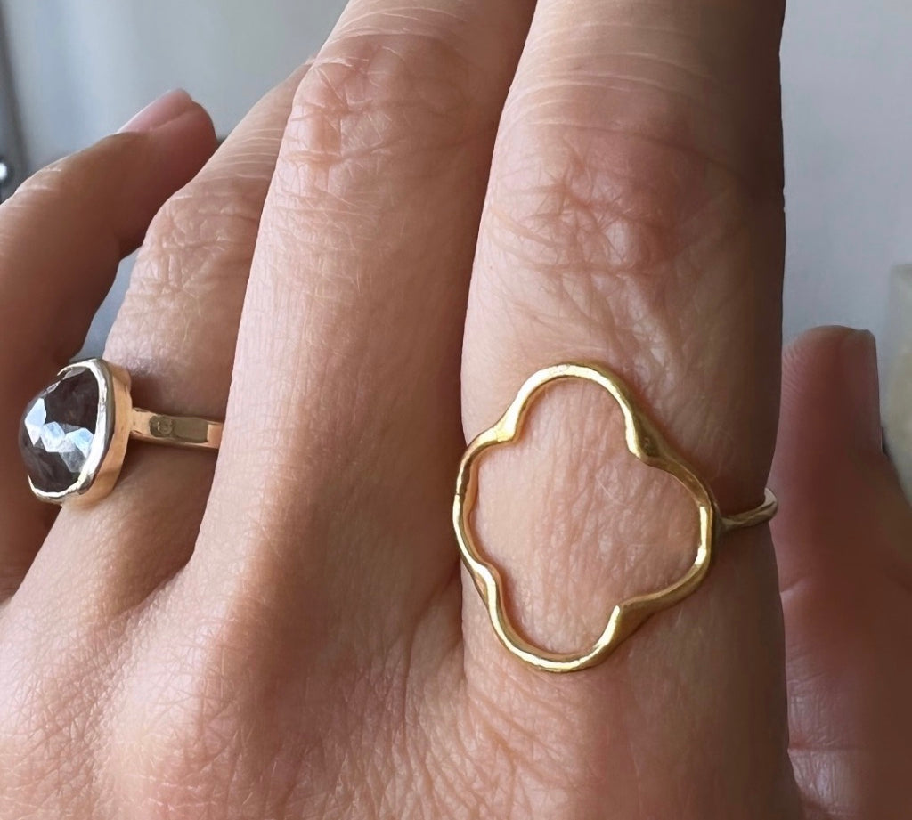 Gold Clover Ring, shown closeup on model